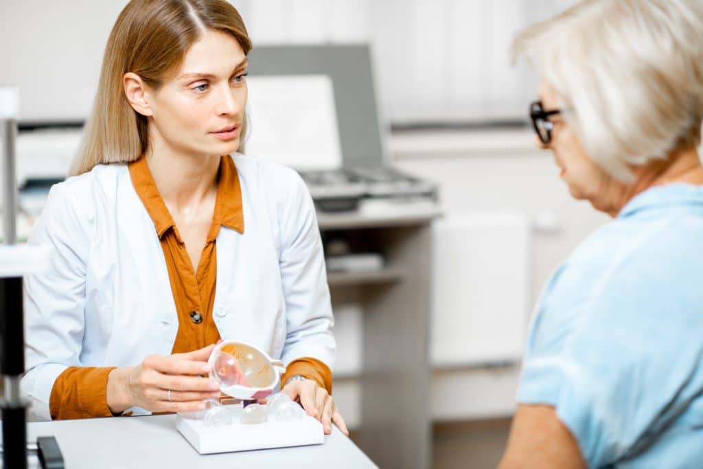 Ophthalmologist consulting a senior patient